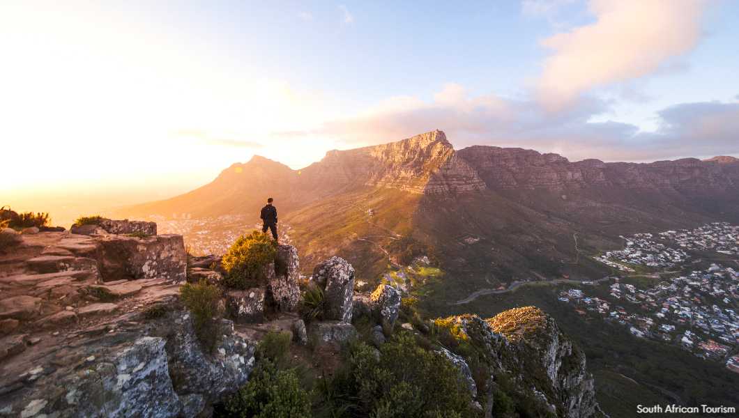 Lion&#039;s Head with Table Mountain in background South African Tourism